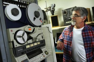 Looking at an old commercial tape machine that was used in TV studios, Ed DiMeglio, of RetroMedia, in Smithfield, converts sound and images stored on obsolete media into digital media. Andrew Dickerman/The Providence Journal